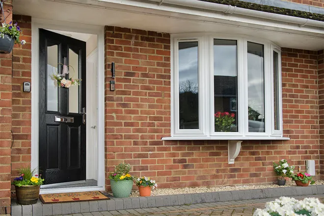 Black Composite door with White Bay windows